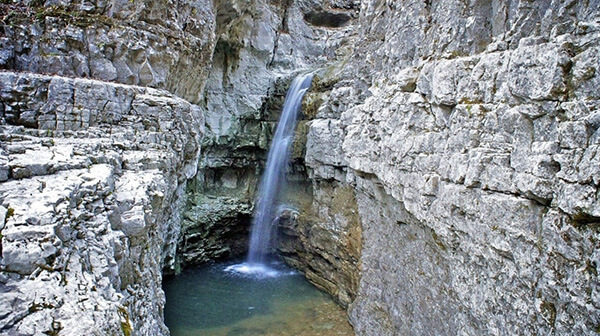 Thin waterfall in a rocky chasm