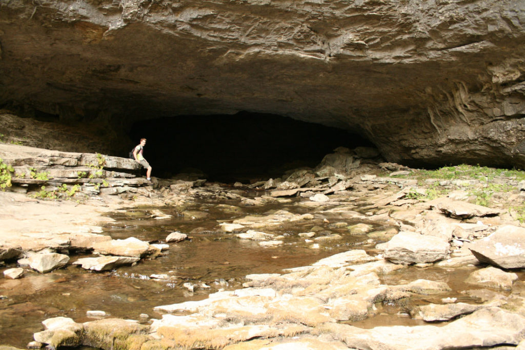 Limestone rock with a dark cave entrance